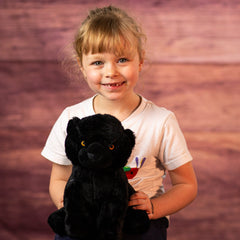 girl holding 10 in stuffed black panther