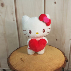9 inch Valentine Hello Kitty with a red bow holding a stuffed red heart