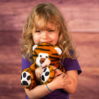 girl holding 8 in stuffed whimsical tiger
