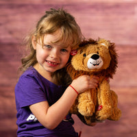 girl holding 10 in stuffed singing lion