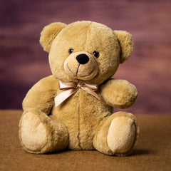 A beige bear that is 9 inches tall while sitting