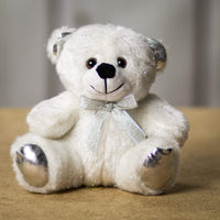 A white bear that is 6 inches tall while sitting