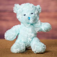 A light blue bear that's 10 inches tall while standing 