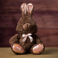 A brown bunny with pinkish trim that is 12 inches tall while sitting