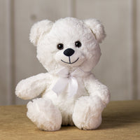A white bear that is 10 inches tall while sitting wearing a matching bow