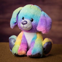 A rainbow dog that is 10.5 inches tall while sitting