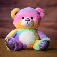 A rainbow bear that is 10 inches tall while sitting