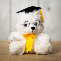 A white grad bear that is 10 inches tall while standing