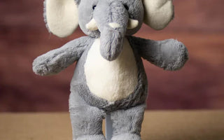 The Symbolism of Stuffed Elephants with Raised Trunks