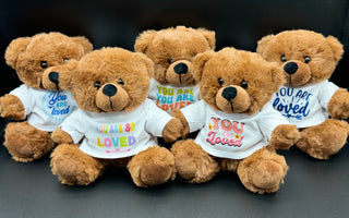Stuffed animals wearing “You are Loved” shirts arranged for donation after Hurricane Helene