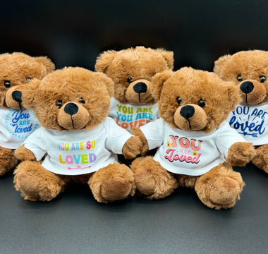 Stuffed animals wearing “You are Loved” shirts arranged for donation after Hurricane Helene