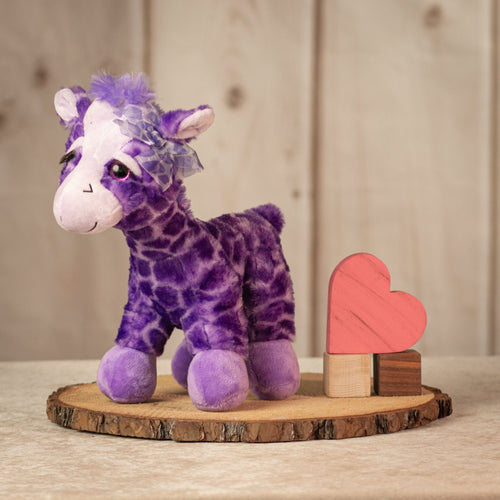 12 inch  tall purple giraffe with a purple bow and eyelashes