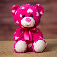 Pink 7.5 inch bear covered in white hearts