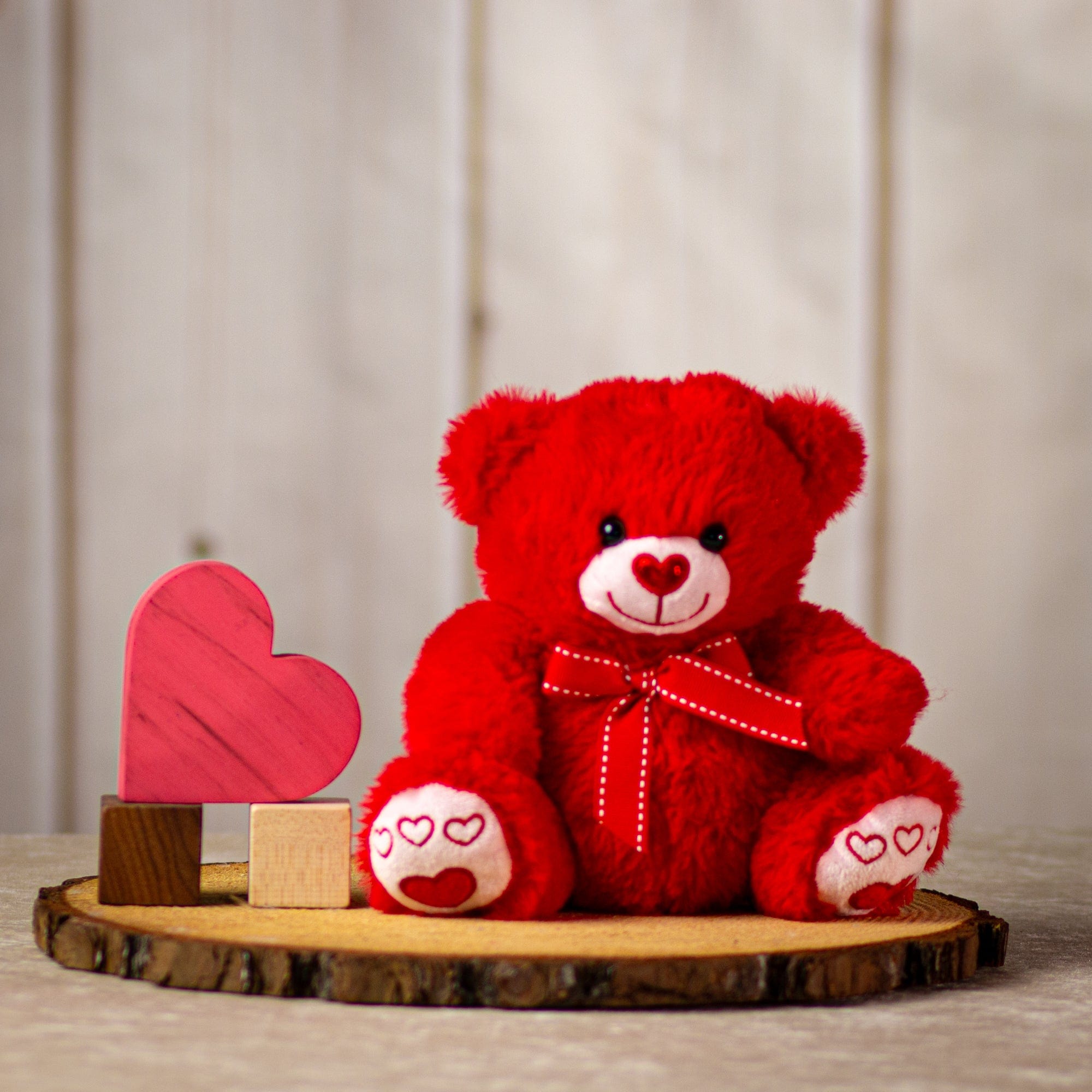 8.5" Red Valentine Bear with a heart nose and heart paws wearing a bow