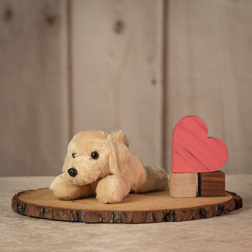 8 inch long laying yellow Labrador pupyl