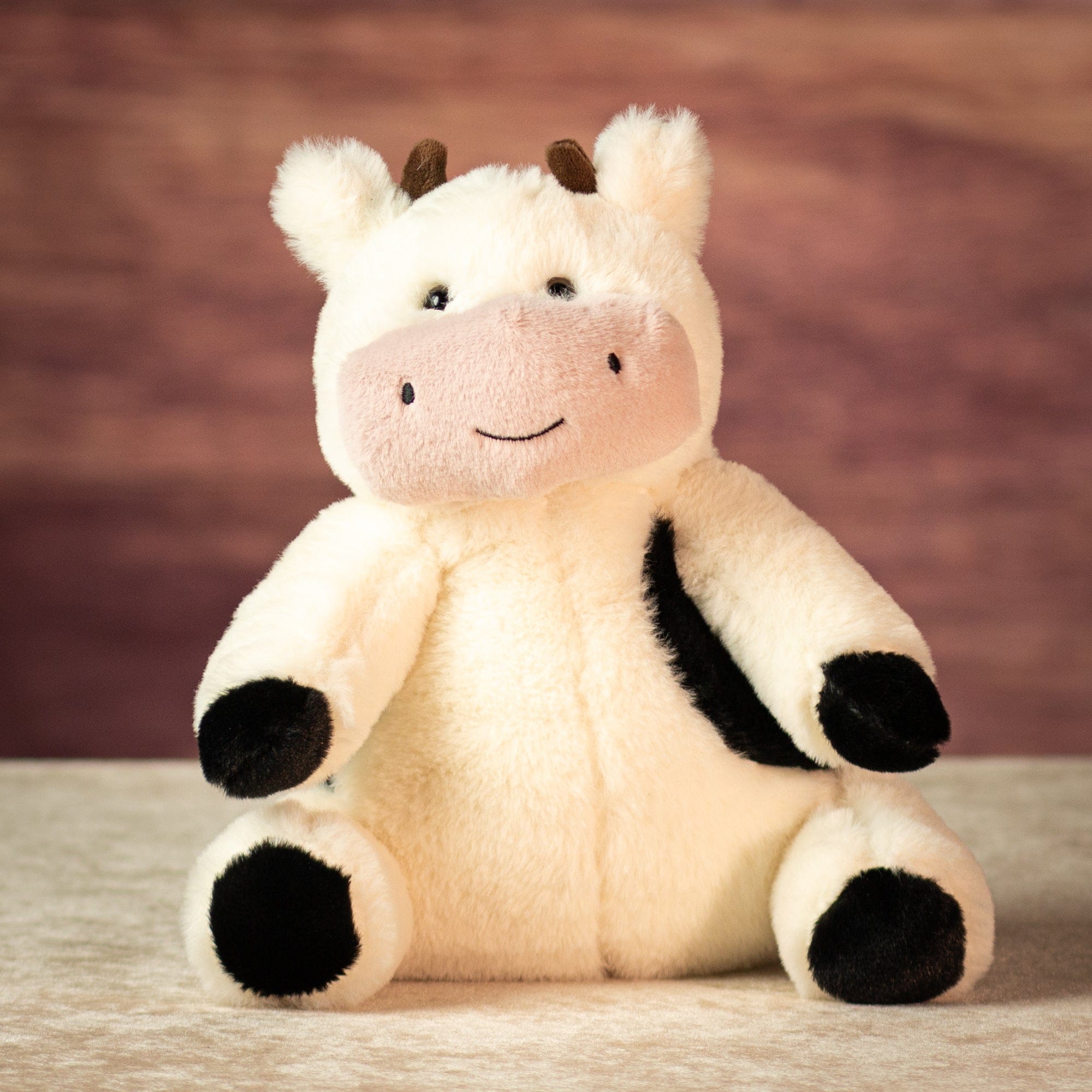 9.5" Sitting Meadow Patch Cow