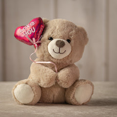 9 inch beige stuffed bear holding a balloon that says "love you"