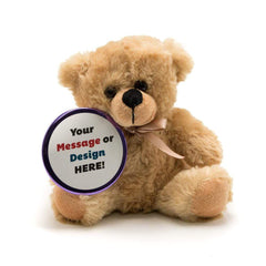A beige bear holding a purple button