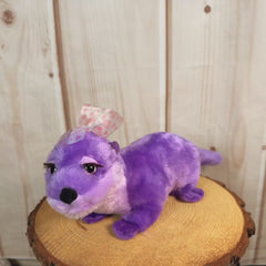18 inch purple otter with a pink polka dotted bow.