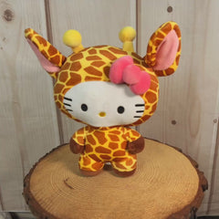 Hello kitty stuffed animal dressed as a giraffe wearing a pink bow