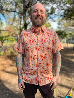 man wearing beary cheerful aloha shirt in peach with valentines bears on it
