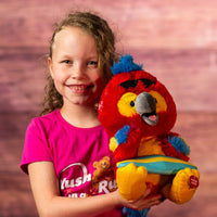 girl holding 11 in stuffed singing red parrot wearing sunglasses and a surfboard