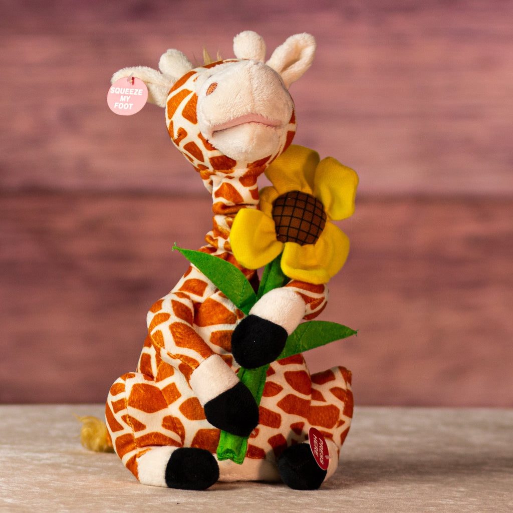 12 in stuffed singing giraffe holding a flower 