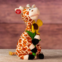 12 in stuffed singing giraffe holding a flower