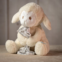 10" cream Prayerful Bedtime Lamb plush with sewn eyes and holding a plaid blanket and says prayer
