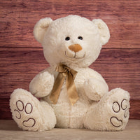 18 in cream stuffed bear with paw prints on paws