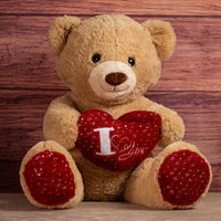 stuffed brown valentines bear holding i love you heart