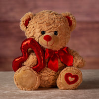 12 in stuffed brown valentine bear holding sequin heart and wearing bow