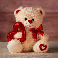 12 in stuffed cream valentine bear holding sequin heart and wearing bow