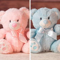 9 in stuffed pink and blue baby bear wearing a bow