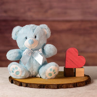 9 in stuffed blue baby bear wearing a bow