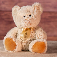 10 in cream stuffed teddy bear set wearing a bow