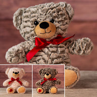 12 in two tone bear wearing a red bow and has heart on paw