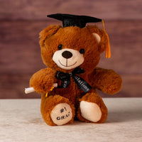 9 in stuffed brown graduation bear in cap, celebratory bow and diploma