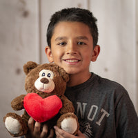 boy holding 9.5" Simple Love Bear Duo in brown holding red heart