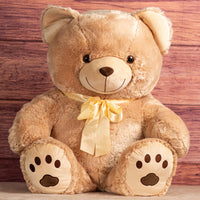 36 in light brown stuffed bear wearing yellow bow