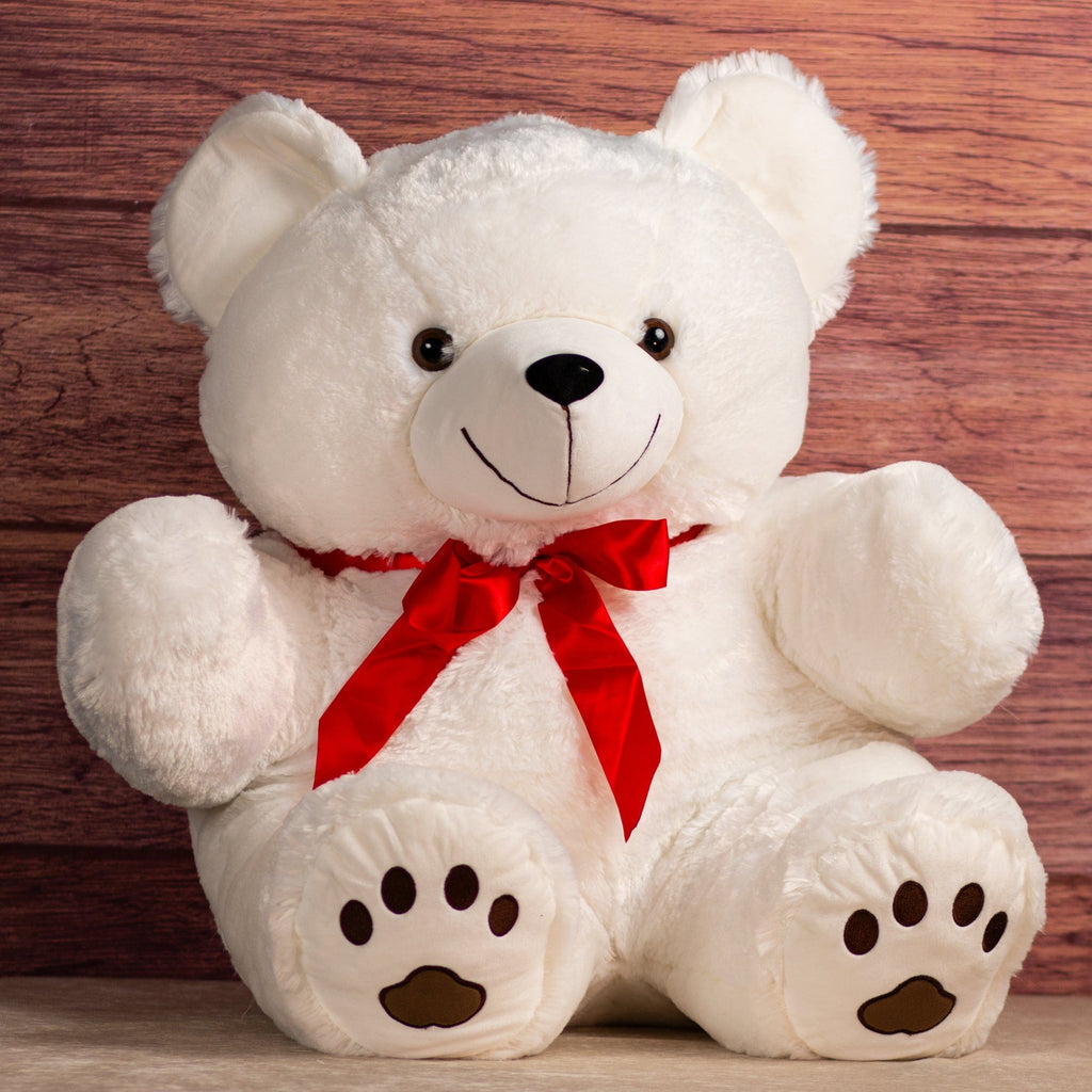 36 in white stuffed bear wearing a red bow
