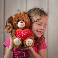 girl holding 9" Sitting Valentine Doggie in brown