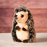 10 inch stuffed hedgehog with eyelashes and a bow