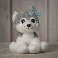 10" stuffed grey huskey with eyelashes and blue eyes wearing a bow