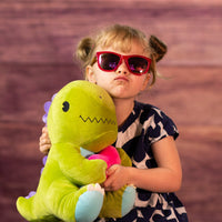girl holding 12 in stuffed valentines dinosaur