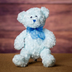 A blue bear that is 14 inches tall while standing