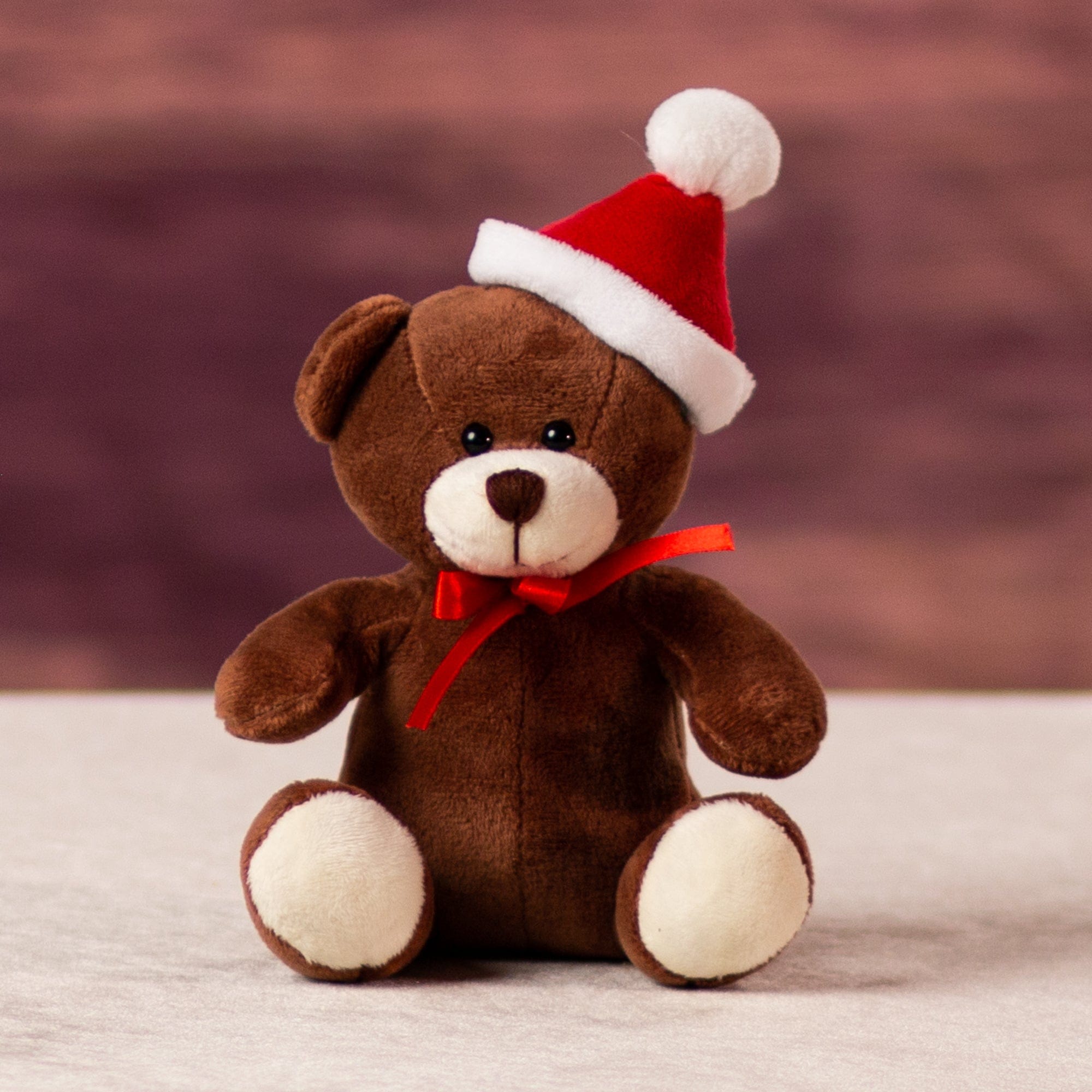 A brown bear that is 5.5 inches tall while sitting