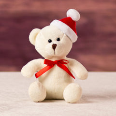 A white bear that is 5.5 inches tall while sitting