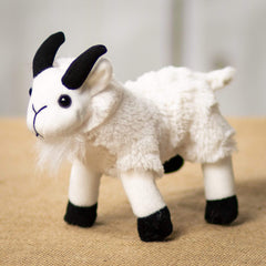 A white goat that is 7 inches from head to tail