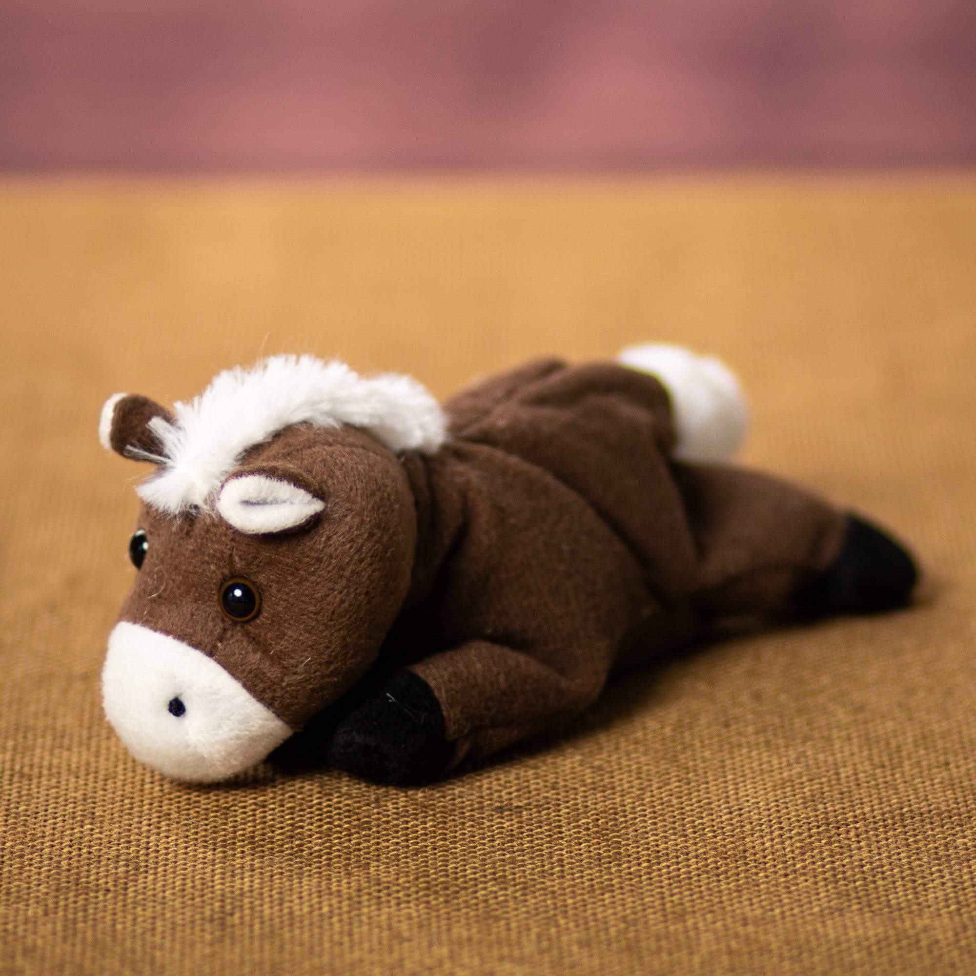 A laying mustang that is 8 inches from head to tail 